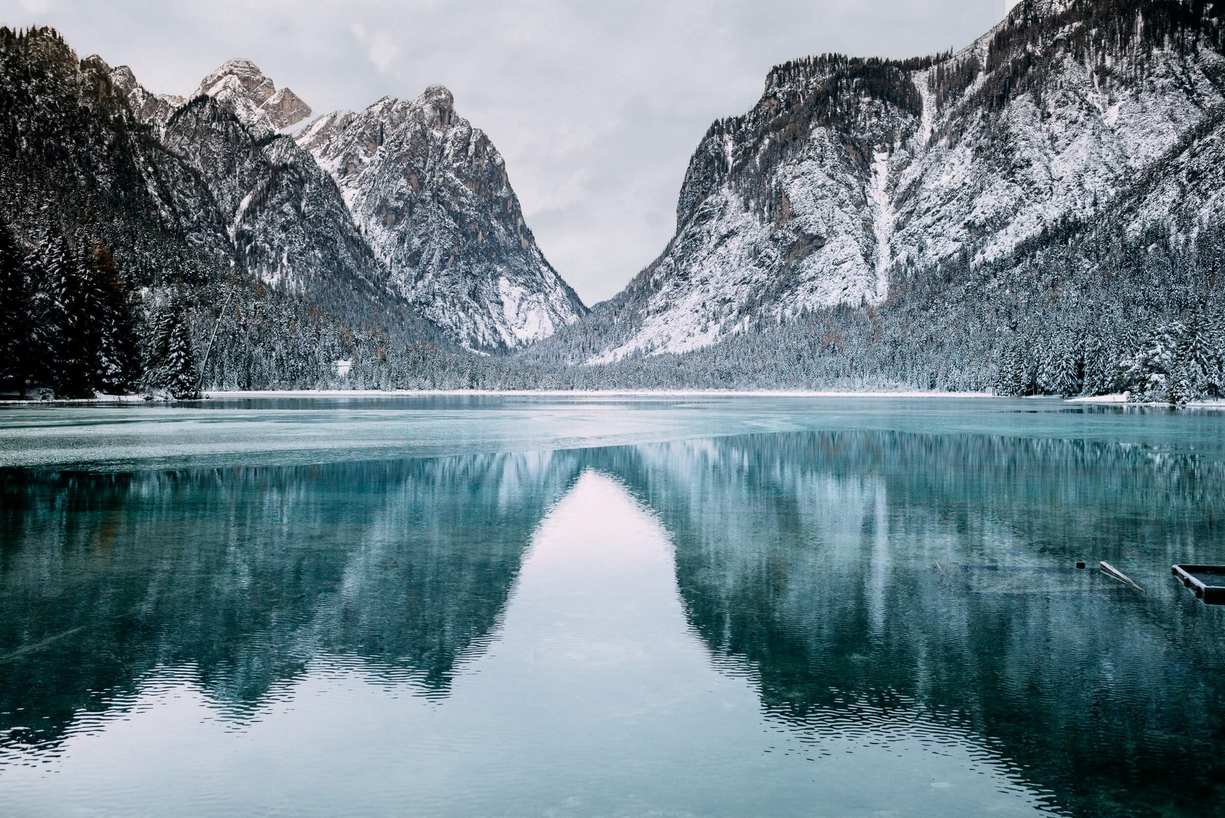 A lake surrounded by icy mountains.